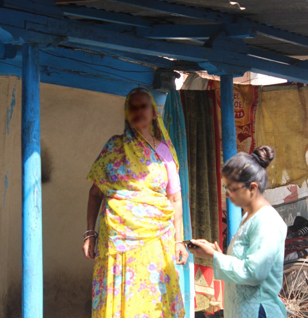 The field executive asking questions to Arun's grandmother.