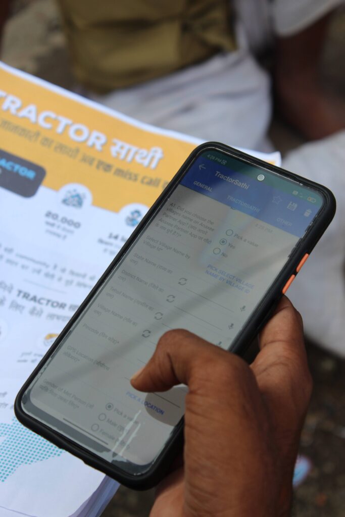 Anaxee's Digital Runner holding mobile phone on his hand, taking data of retailer for a Non FMCG project.