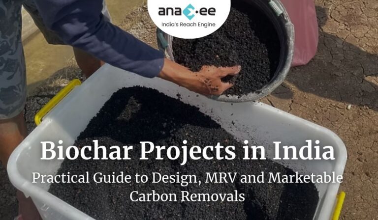 Field worker's hand pouring granular biochar from a bucket into a white tub; granular black biochar ready for soil application in a rural pilot.
